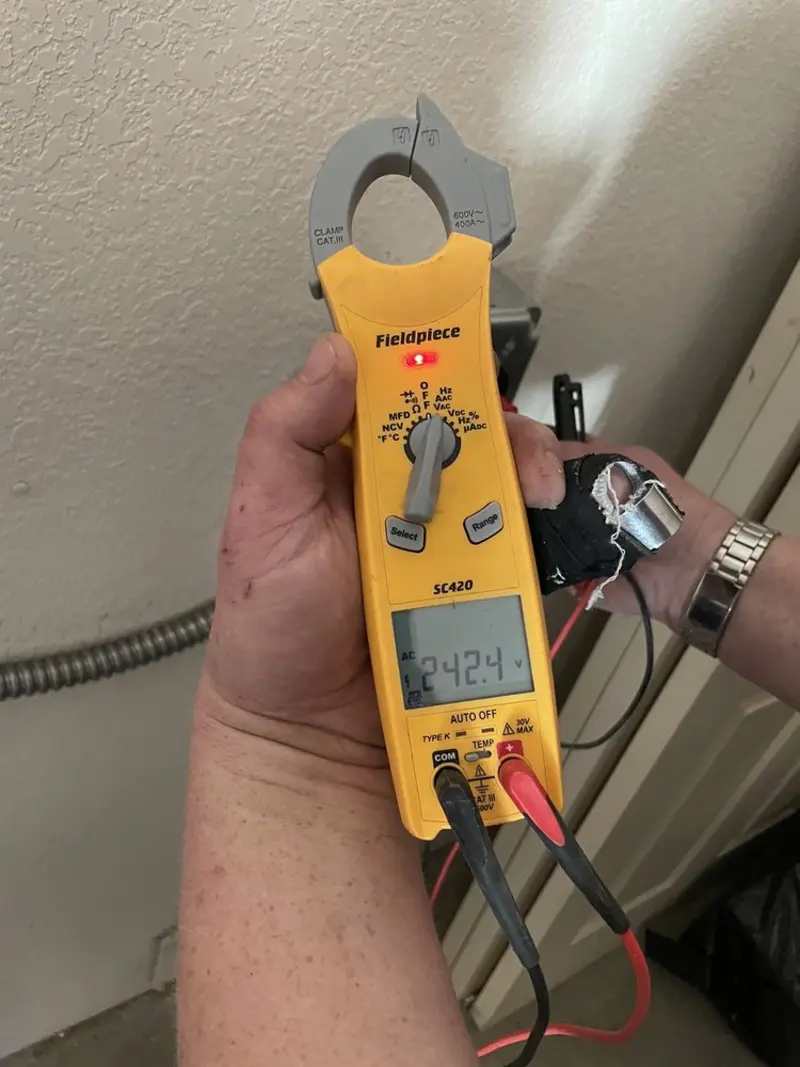 Voltage testing with clamp meter during Generator Installation in West University Place
